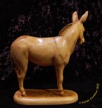 Donkey standing with his head turned to the side carved by dylan goodson