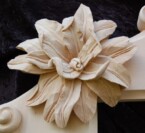 close up of one of the flowers on the corners of the ornate frame
