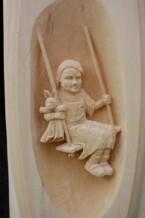 close of one of the relief carvings on the ornate frame