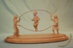 Girls at play Girls jumping rope carved by dylan goodson