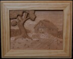 pictorial relief scene of a country landscape with a barn in the background designed and carved by dylan goodson