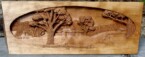 Stove hood with a pictorial relief scene carved on it by dylan goodson