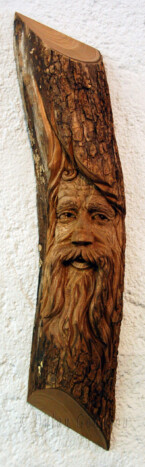 Wood Spirit carved into half a log