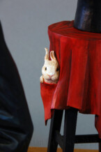 The rabbit tucked in the secret pocket of the table cloth on Dylan Goodson's wood carving, "The Magician".
